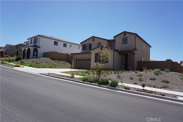 33045 Chiffon Ln, Winchester, CA 92596 - view of front of house featuring an attached garage, stucco siding, driveway, and fence
