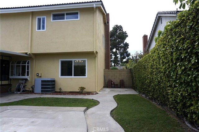 18410 Alexander Ave, Cerritos, CA 90703 - back of house featuring stucco siding and a patio