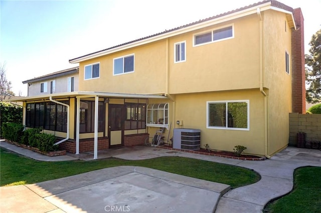 18410 Alexander Ave, Cerritos, CA 90703 - back of house featuring a sunroom, stucco siding, and a patio