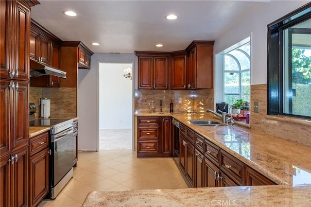 18410 Alexander Ave, Cerritos, CA 90703 - kitchen featuring stainless steel electric stove, under cabinet range hood, recessed lighting, light stone countertops, and decorative backsplash