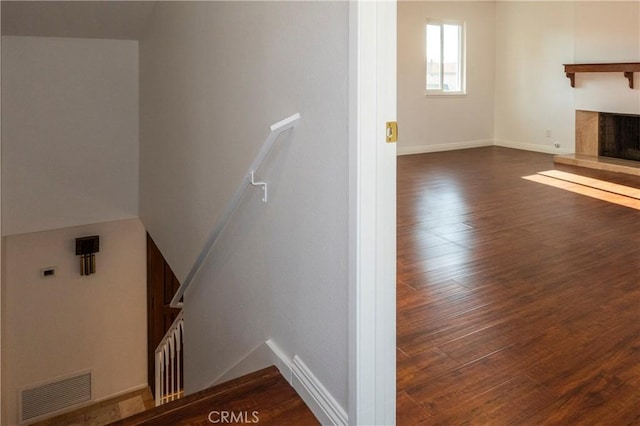 18410 Alexander Ave, Cerritos, CA 90703 - stairs with wood finished floors and a fireplace with raised hearth