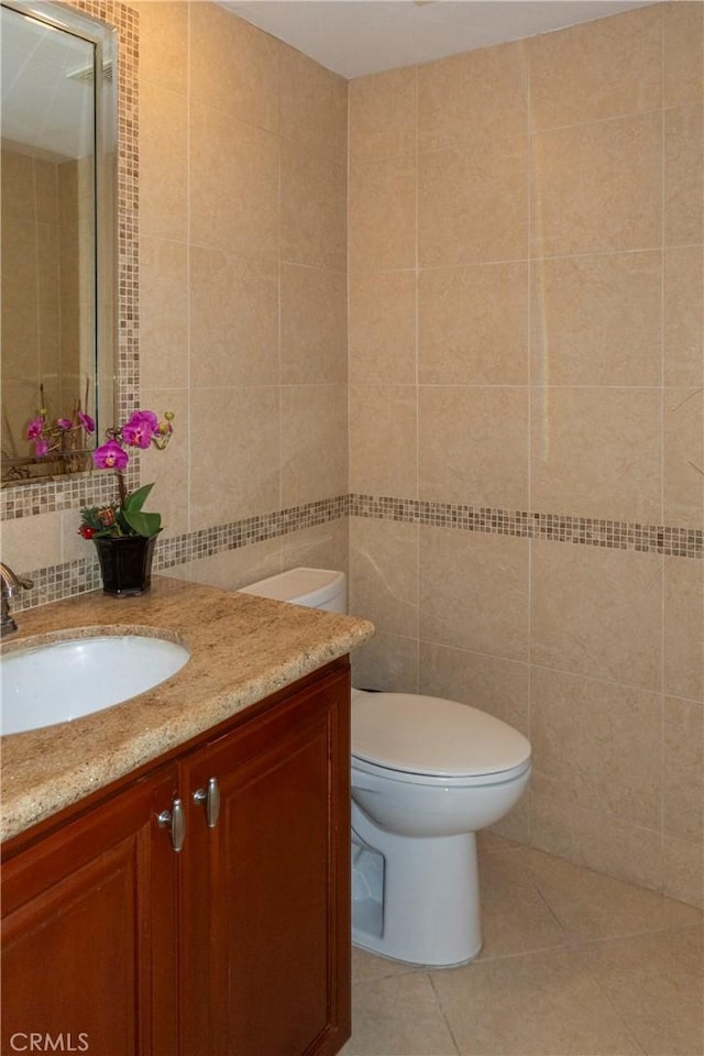 18410 Alexander Ave, Cerritos, CA 90703 - half bath featuring tile walls, vanity, and tile patterned floors