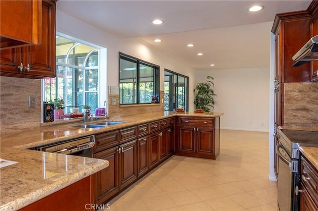 18410 Alexander Ave, Cerritos, CA 90703 - kitchen with recessed lighting, healthy amount of natural light, light stone counters, decorative backsplash, and range with electric stovetop