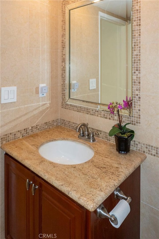 18410 Alexander Ave, Cerritos, CA 90703 - bathroom featuring tile walls, vanity, and backsplash