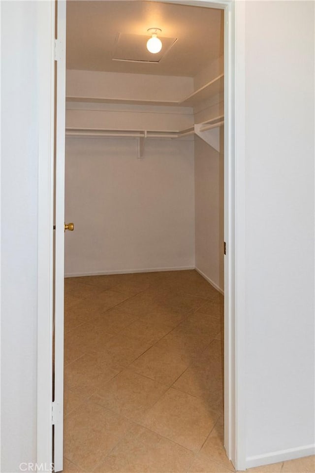 18410 Alexander Ave, Cerritos, CA 90703 - walk in closet featuring light tile patterned floors