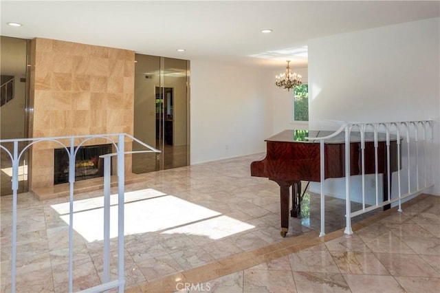 18410 Alexander Ave, Cerritos, CA 90703 - spare room featuring a tile fireplace, recessed lighting, a chandelier, and marble tiled floors