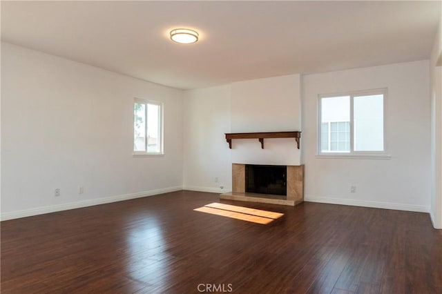 18410 Alexander Ave, Cerritos, CA 90703 - unfurnished living room with dark wood-type flooring and a fireplace with raised hearth