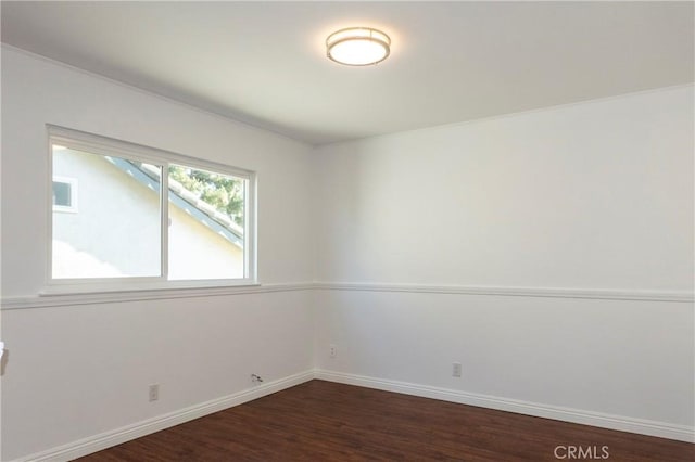 18410 Alexander Ave, Cerritos, CA 90703 - unfurnished room featuring baseboards and dark wood-style flooring