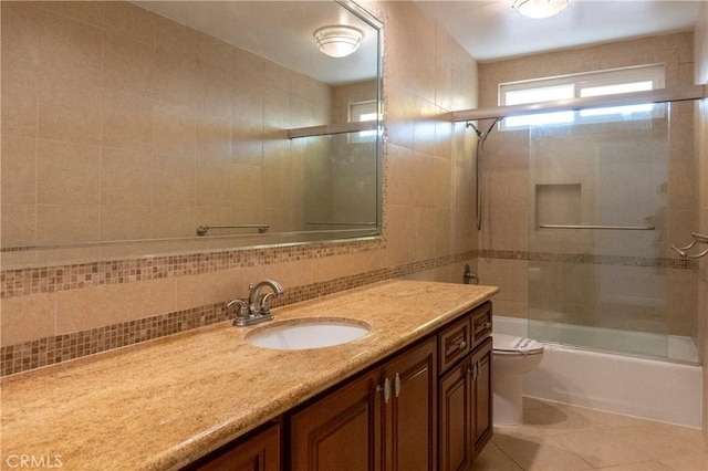 18410 Alexander Ave, Cerritos, CA 90703 - full bath with vanity, shower / bath combination with glass door, tile patterned flooring, and decorative backsplash