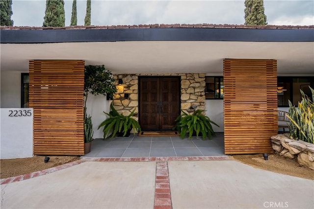 22335 Tiara St, Woodland Hills, CA 91367 - view of exterior entry featuring stucco siding