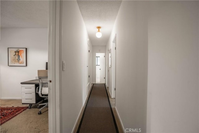 22335 Tiara St, Woodland Hills, CA 91367 - corridor with baseboards, carpet, and a textured ceiling
