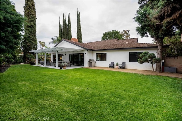 22335 Tiara St, Woodland Hills, CA 91367 - back of house with a pergola, a patio area, a lawn, and stucco siding
