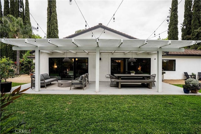 22335 Tiara St, Woodland Hills, CA 91367 - back of property featuring a pergola, outdoor lounge area, a lawn, and stucco siding