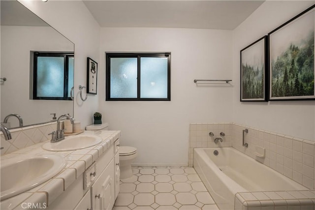 22335 Tiara St, Woodland Hills, CA 91367 - bathroom with a garden tub, a sink, double vanity, baseboards, and toilet
