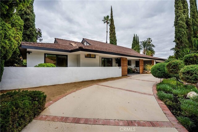 22335 Tiara St, Woodland Hills, CA 91367 - back of property featuring stucco siding and fence