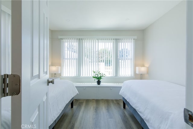 bedroom featuring dark wood-style floors