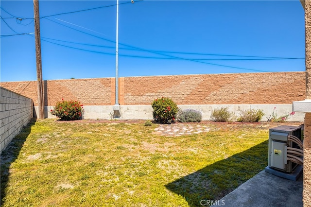 view of yard with a fenced backyard