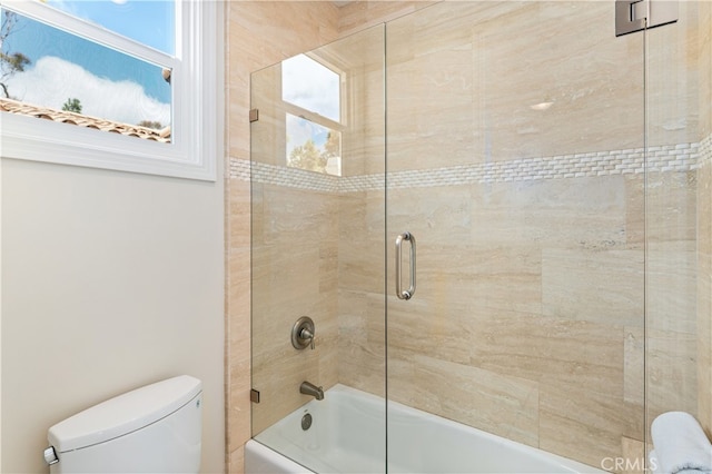 full bath featuring toilet and enclosed tub / shower combo
