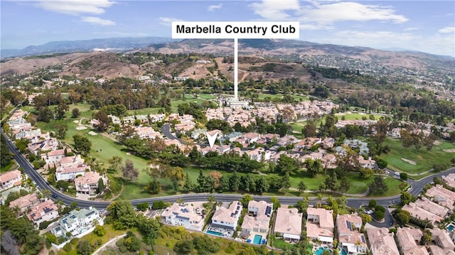 birds eye view of property featuring a mountain view, a residential view, and view of golf course