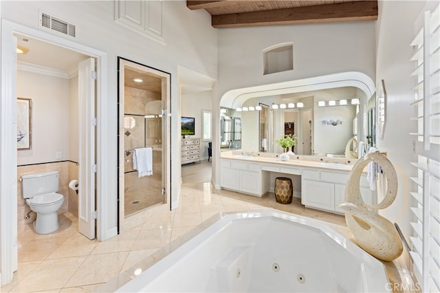 bathroom featuring double vanity, a stall shower, tile patterned floors, toilet, and visible vents