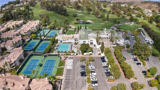 bird's eye view with a water view and golf course view
