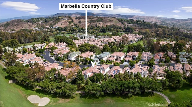 aerial view featuring a residential view, golf course view, and a mountain view