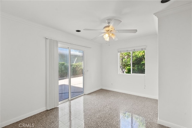 spare room featuring a wealth of natural light, granite finish floor, and baseboards