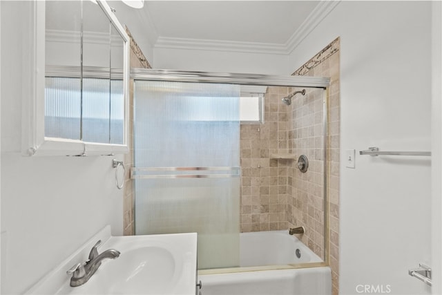 full bathroom with shower / bath combination with glass door, a sink, and crown molding