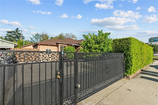 view of gate featuring fence