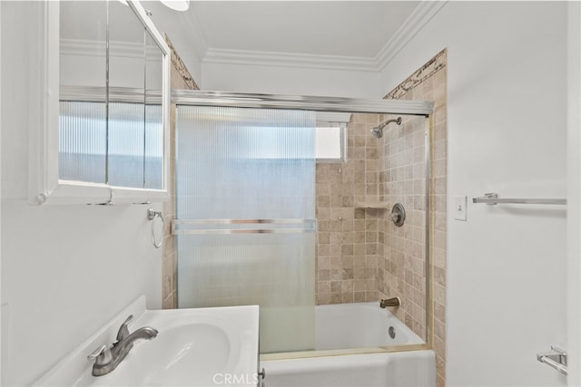 full bathroom featuring a sink, ornamental molding, and enclosed tub / shower combo