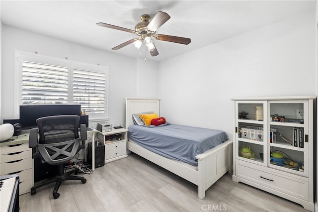 1212 Goldenview Dr, Corona, CA 92882 - bedroom with light wood-type flooring, an office area, and a ceiling fan