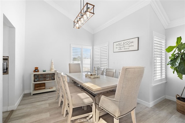 1212 Goldenview Dr, Corona, CA 92882 - dining space featuring light wood finished floors, crown molding, healthy amount of natural light, baseboards, and high vaulted ceiling