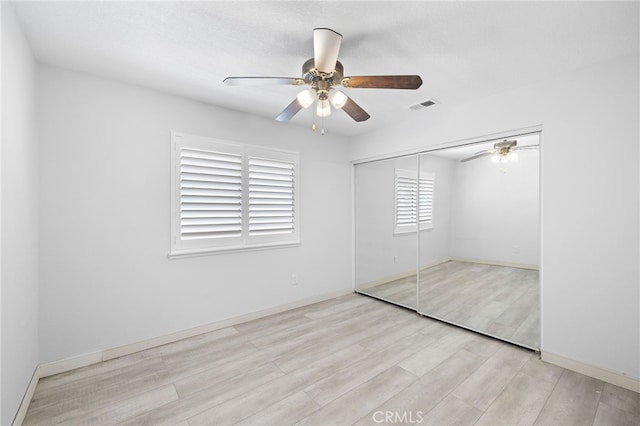 1212 Goldenview Dr, Corona, CA 92882 - unfurnished bedroom with wood finished floors, a closet, ceiling fan, and baseboards
