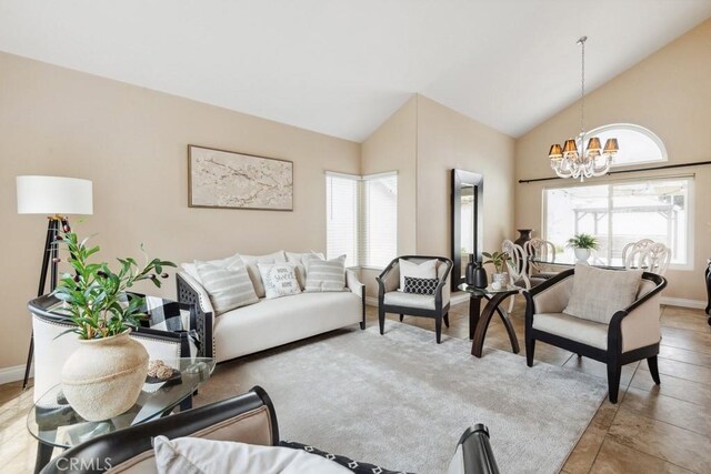 2145 Lenita Cir, Corona, CA 92882 - living room featuring baseboards, high vaulted ceiling, plenty of natural light, and a notable chandelier