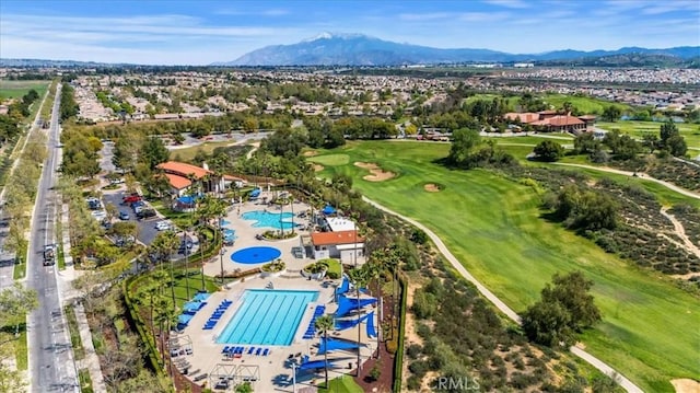 bird's eye view with a mountain view and view of golf course