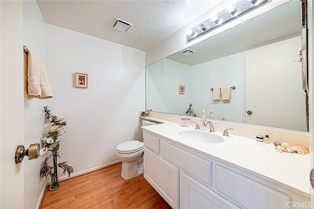 22933 Estoril Dr Unit 1, Diamond Bar, CA 91765 - bathroom with toilet, visible vents, baseboards, and wood finished floors