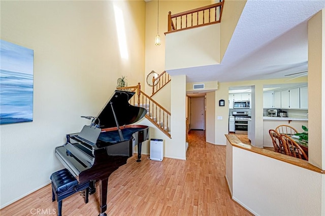 22933 Estoril Dr Unit 1, Diamond Bar, CA 91765 - foyer featuring visible vents, baseboards, light wood finished floors, and stairs