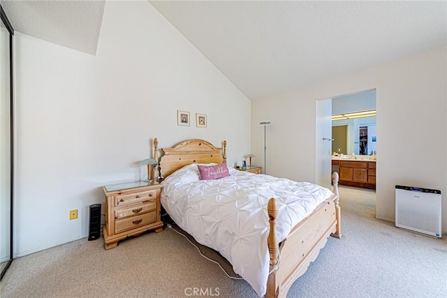 22933 Estoril Dr Unit 1, Diamond Bar, CA 91765 - bedroom with ensuite bathroom, light colored carpet, and vaulted ceiling
