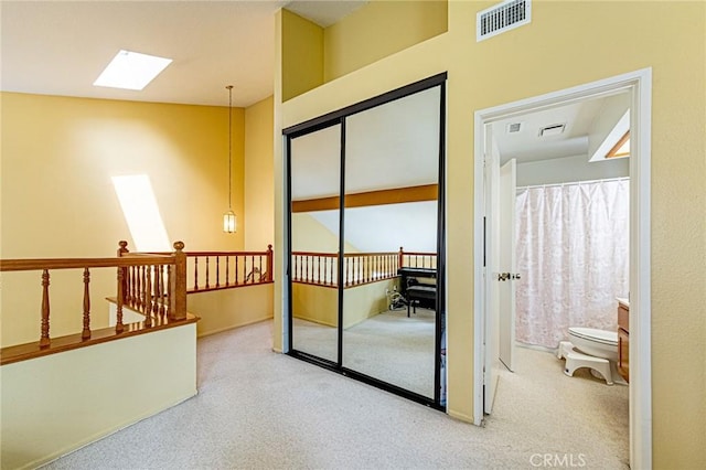 22933 Estoril Dr Unit 1, Diamond Bar, CA 91765 - interior space with visible vents, a skylight, an upstairs landing, and carpet flooring