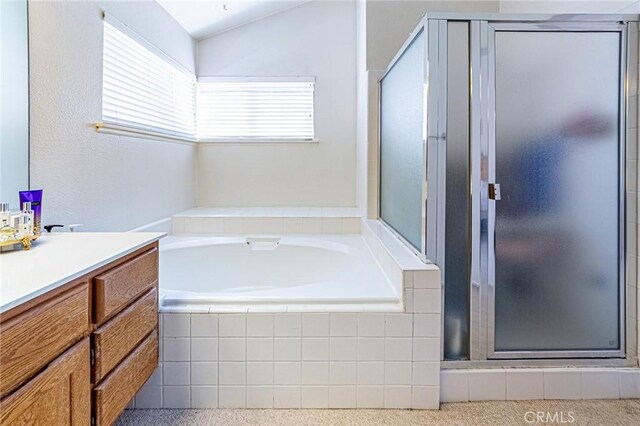 22933 Estoril Dr Unit 1, Diamond Bar, CA 91765 - bathroom with a bath, vaulted ceiling, vanity, and a stall shower