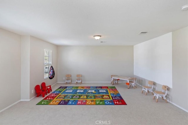 playroom with carpet flooring and baseboards