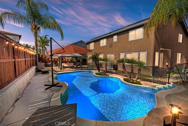 view of swimming pool featuring a fenced in pool, a patio, and a fenced backyard