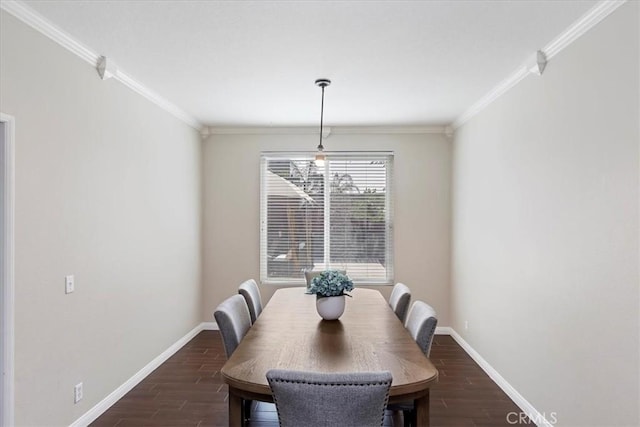 dining area with dark wood-style floors, baseboards, and ornamental molding