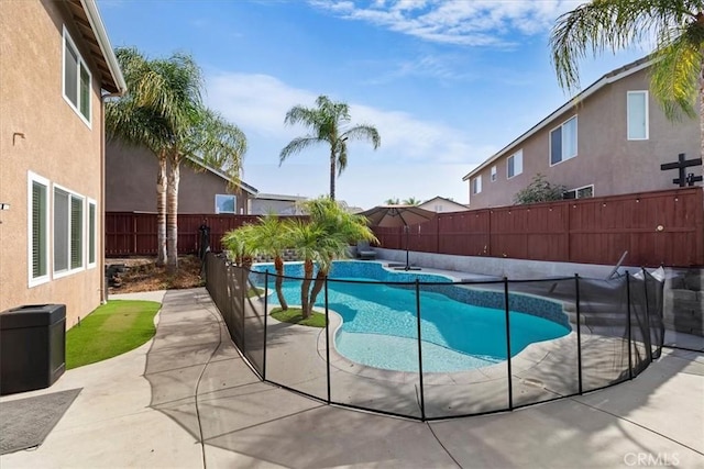 view of swimming pool with a fenced in pool, a patio, and a fenced backyard