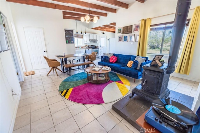 3667 Lucerne Vista Ave, Yucca Valley, CA 92284 - living room with a wood stove, light tile patterned floors, beam ceiling, a chandelier, and baseboards