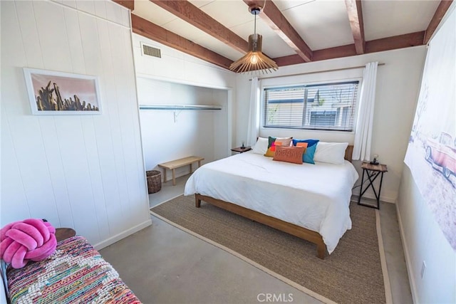 bedroom with visible vents, baseboards, and beamed ceiling