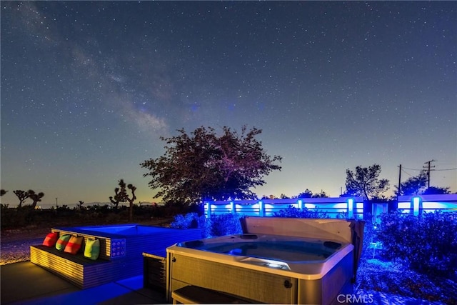 exterior space with a hot tub