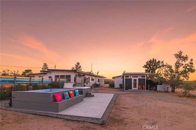 view of swimming pool with a swimming pool, an outdoor structure, and a patio