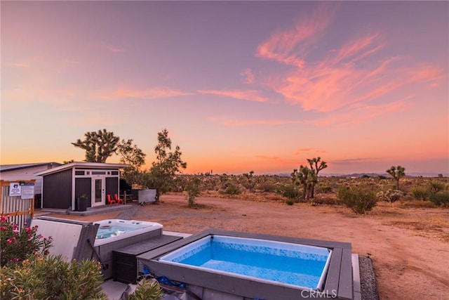 3667 Lucerne Vista Ave, Yucca Valley, CA 92284 - view of swimming pool featuring an outdoor hot tub and an outdoor structure
