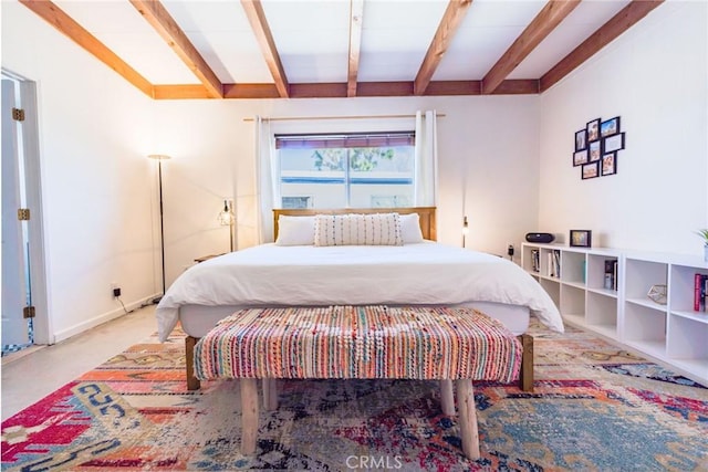 bedroom with beamed ceiling and baseboards